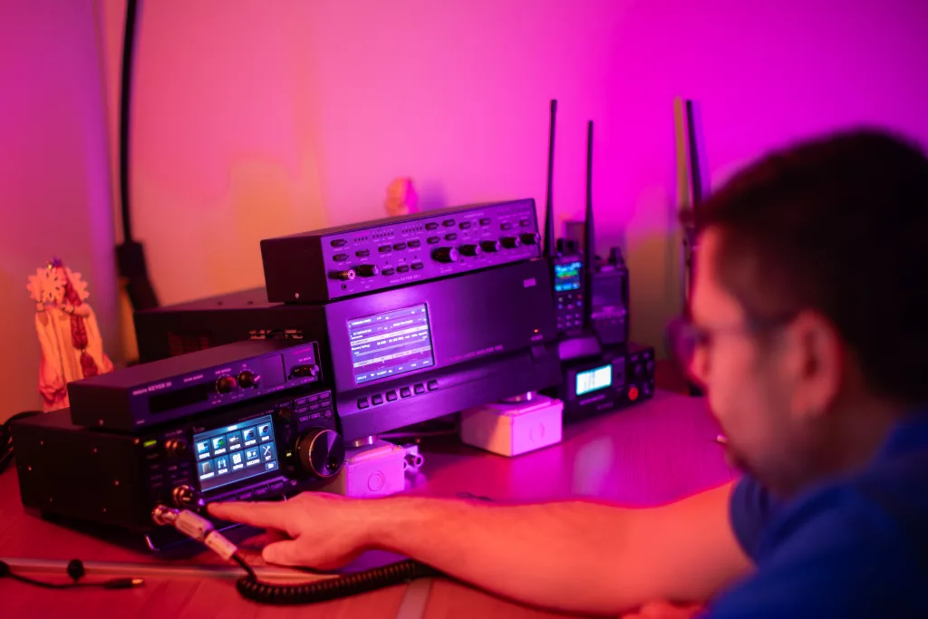 Amateur radio station with HF transceivers and amplifiers on the desk
